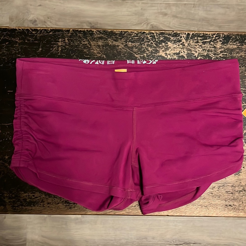 NWT Lucy purple shorts w/ gathered sides. Size medium.